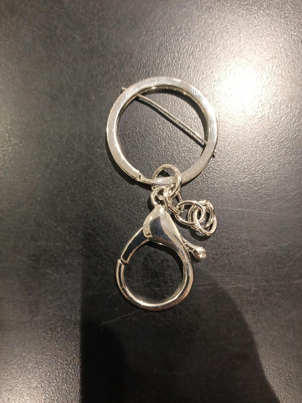 Key ring with chain shown clipped to a swivel lobster hook